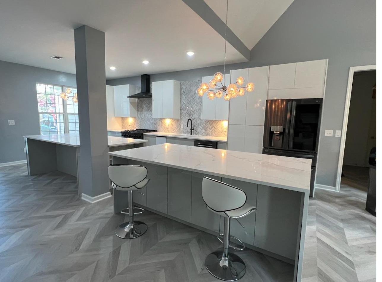 An open-plan kitchen with an island, built from these cabinets